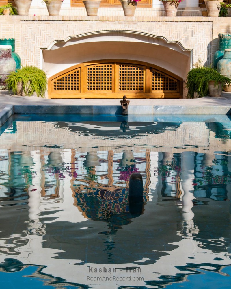 The reflection of the historic Manda Hotel in Kashan, Iran. Like dozens of other old houses, it has been given a new life as a boutique hotel instead of being left to decay or replaced by a high-rise building