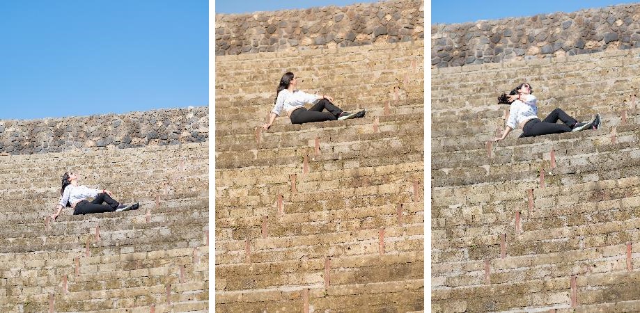 A Persian woman sitting on the ancient steps of the historic city of Pompeii