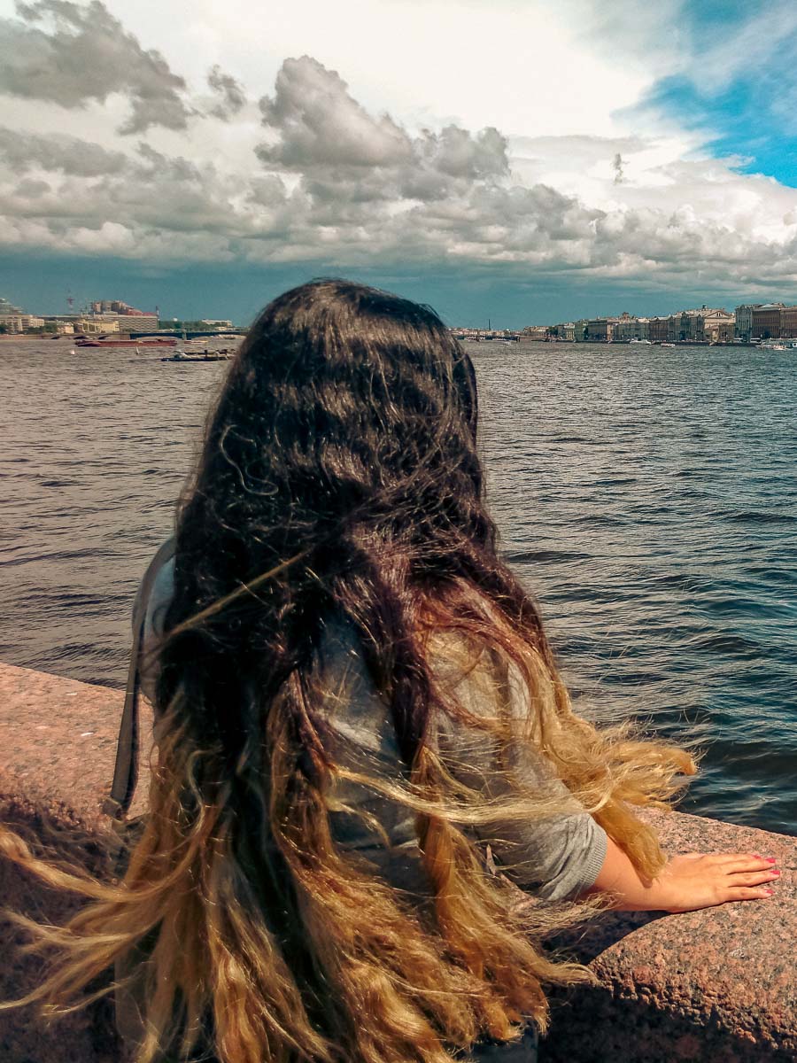 A photo of my spouse by the Neva River in St. Petersburg, Russia