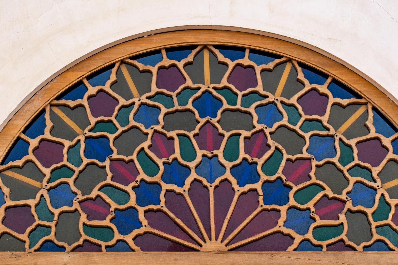 The stained glass in Kashan showcases a blend of classic framing with modern window design