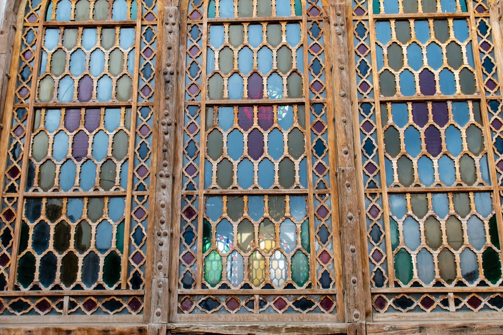 Stained Glass Whispers: Memories Linger in This Kashani Window’s Aged Frame