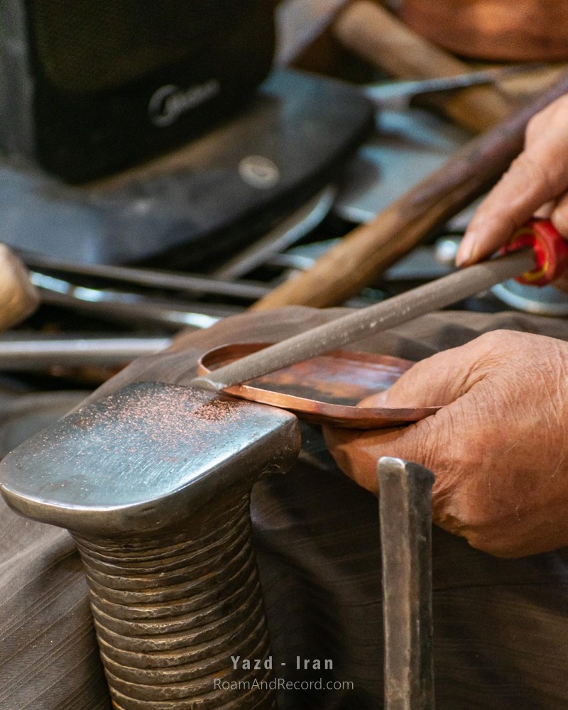 A coppersmith’s hands at the Coppersmiths’ Bazaar in Yazd, Iran. Generations of artisans have worked to keep this traditional Iranian craft alive