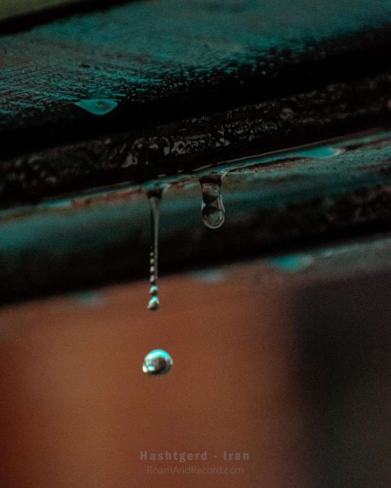 A drop of water falling from the edge of a gazebo in our garden in Tehran