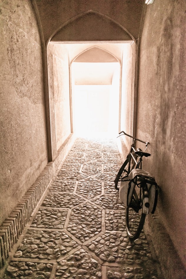 The high, mud-brick walls, painted in a uniform earthy hue, provided the only respite from the sun's relentless glare in this minimalist alleyway