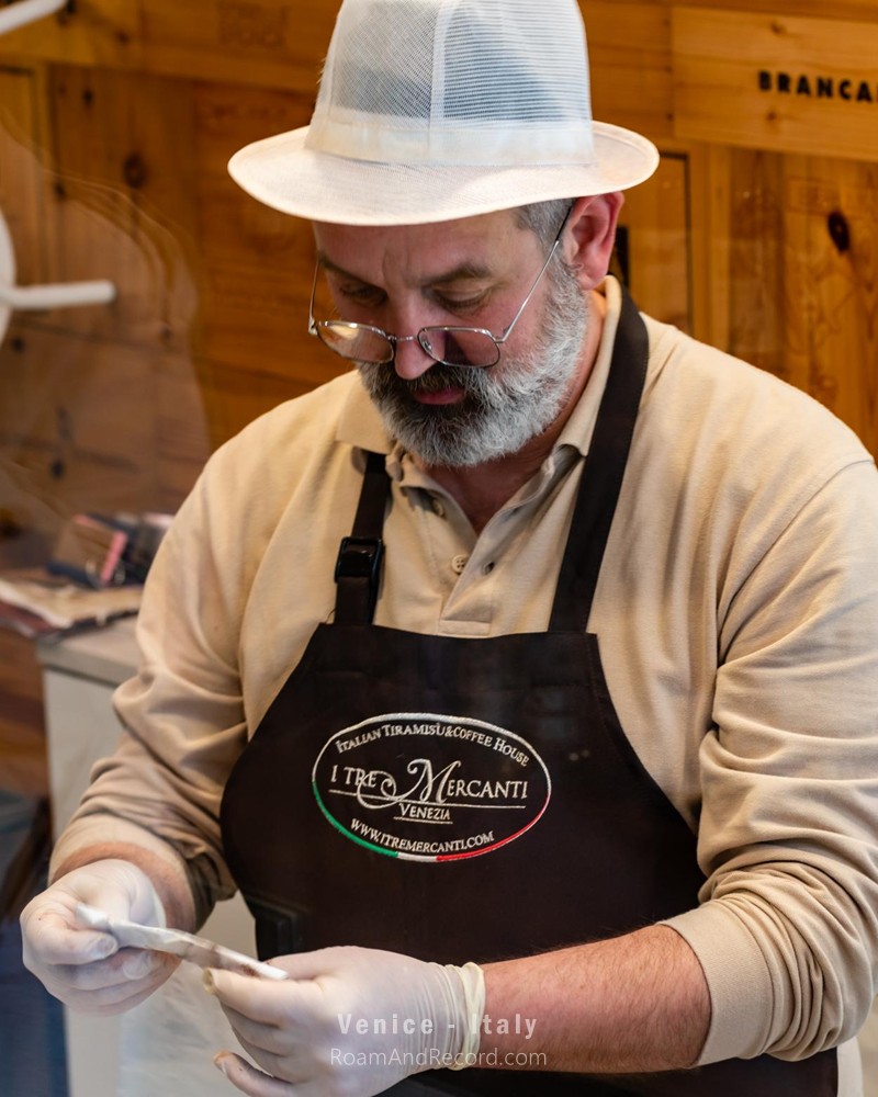 One of the staff members at I Tre Mercanti in Venice, a shop that has been serving authentic Italian tiramisu for decades