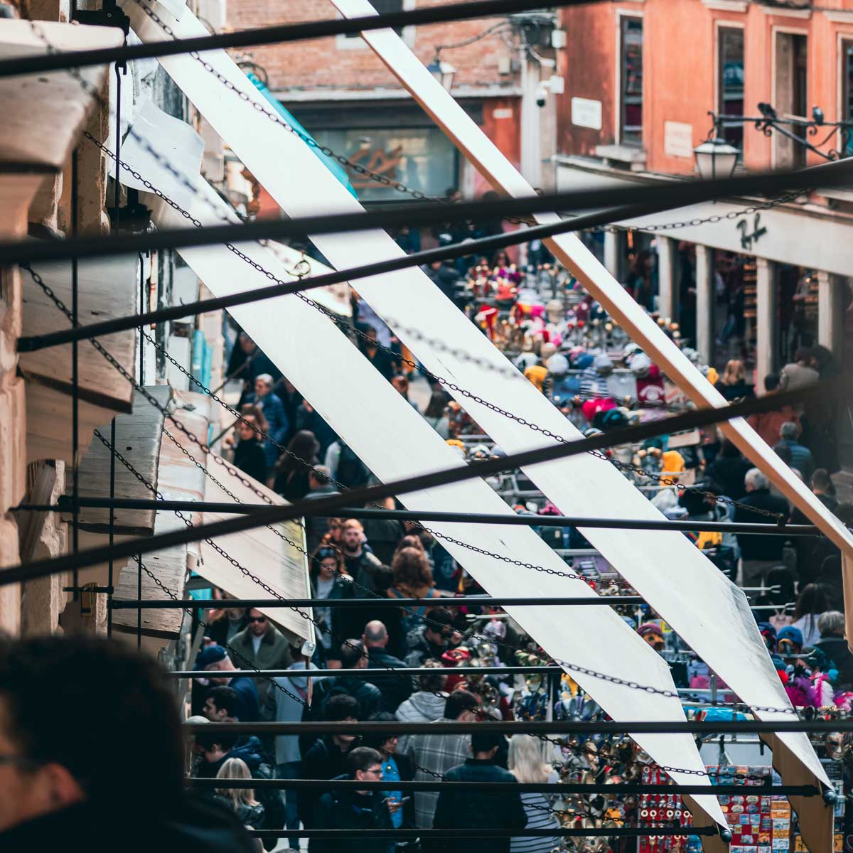 A large crowd of tourists at the Rialto Market in Venice, Italy, during a not particularly busy season