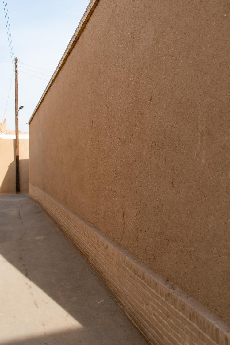 A towering mudbrick wall in Kashan hints at a hidden mansion built by a famed merchant a century ago